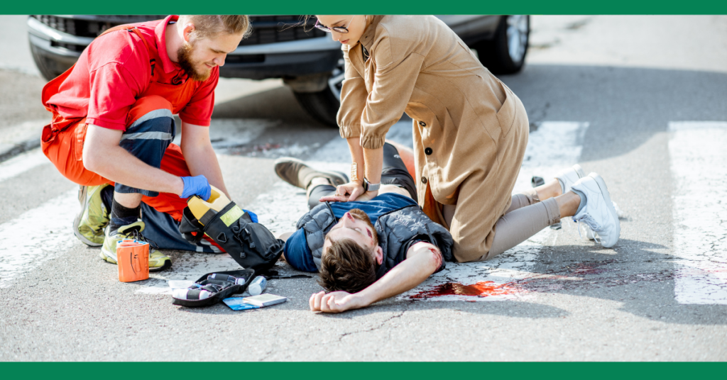 an unconscious man is lying unconscious on a street