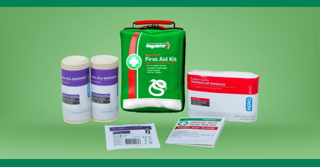 A snake bite first aid kit with its contents displayed. The kit includes a green bag with a white snake symbol, two rolls of snake bite bandages, a cotton calico triangular bandage, and several first aid guides and instructions. The background is a solid light green color