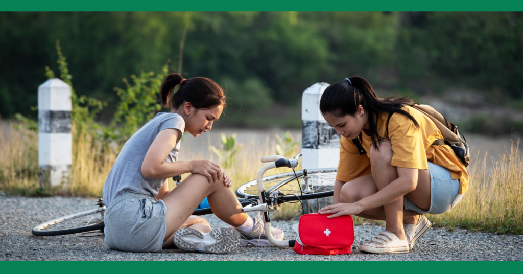 a confident woman helps a woman with an injured ankle