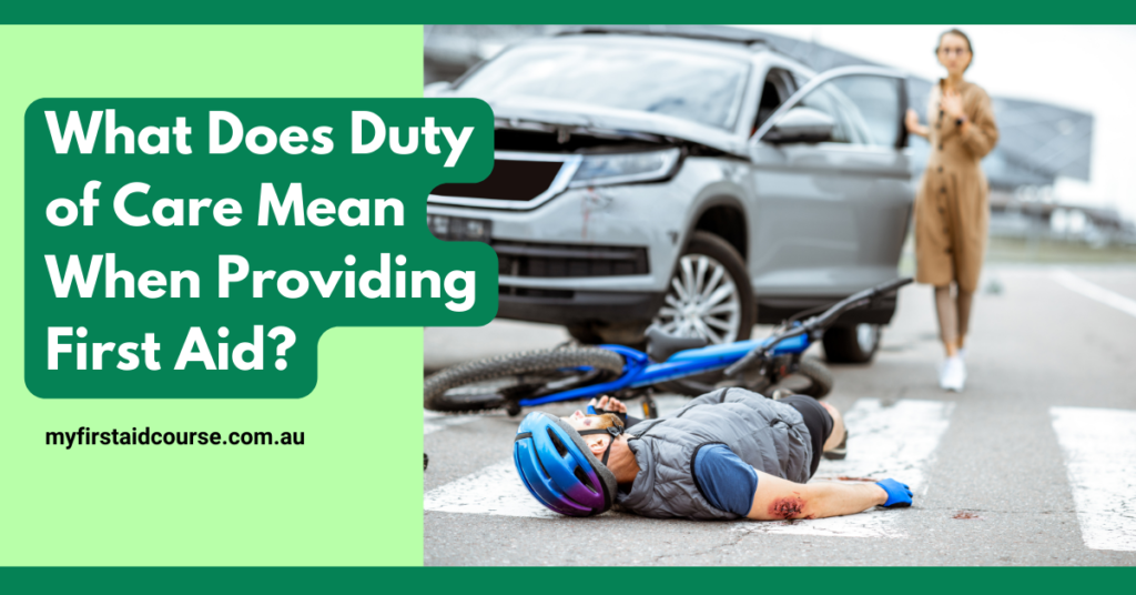 A promotional image asking "What Does Duty of Care Mean When Providing First Aid?" with the URL "myfirstaidcourse.com.au" at the bottom. The image shows a cyclist lying injured on the road next to a bicycle and a car. The cyclist is wearing a helmet and has visible scrapes and bruises on his arms. In the background, a concerned bystander, possibly the driver, stands near the car. The scene emphasizes the urgency and importance of knowing one's duty of care in such situations.